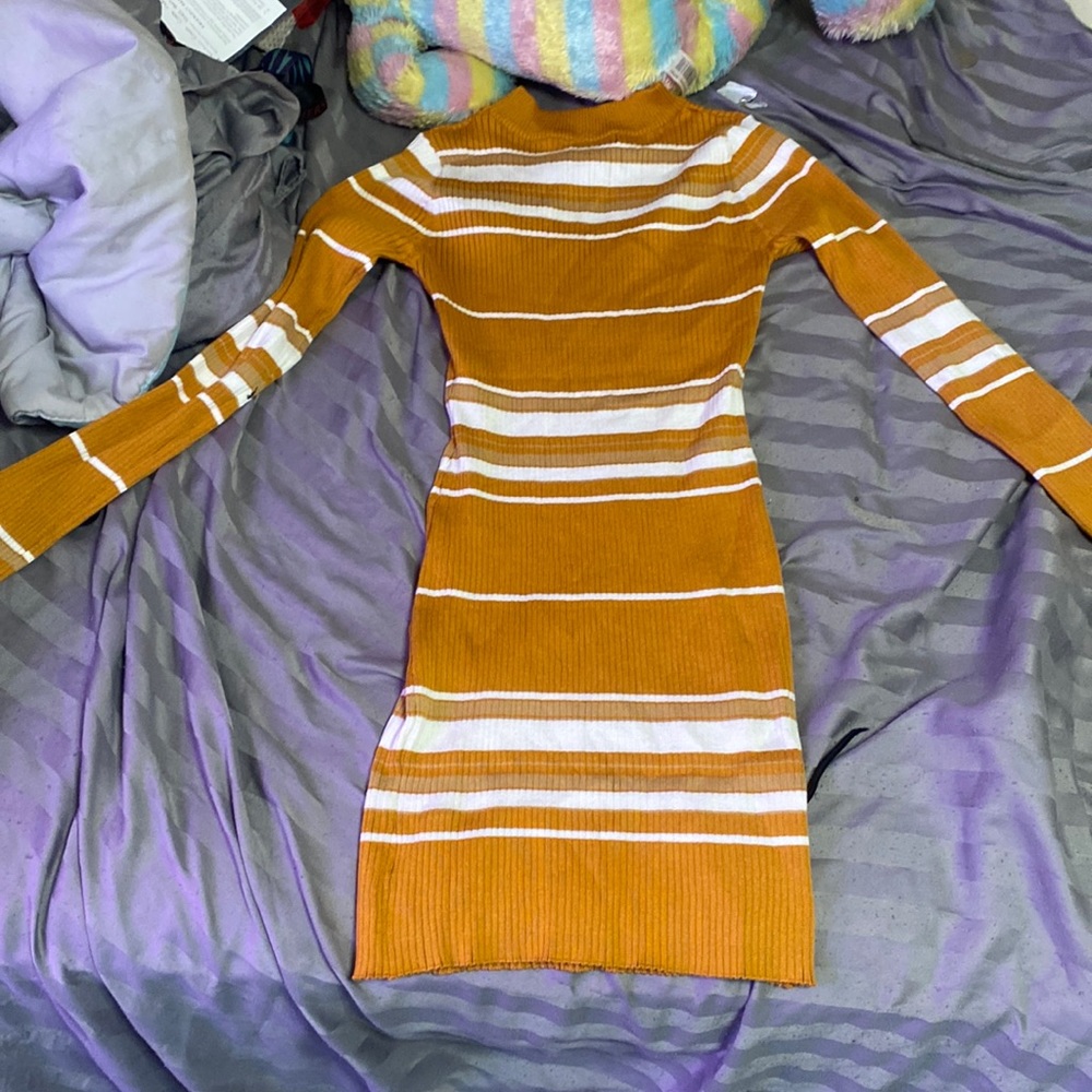 This is a body sweater dress, brownish orange with white stripes and a size XL